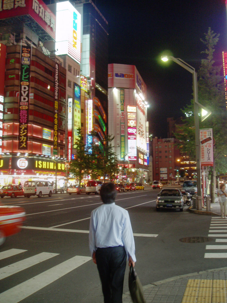 Business man walking down the street in Akihabara