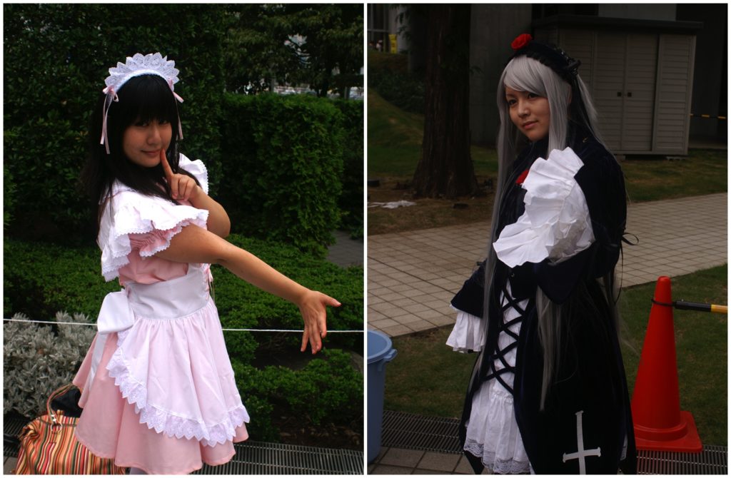 One cosplayer in a maid costume, another in Victorian inspired fashion
