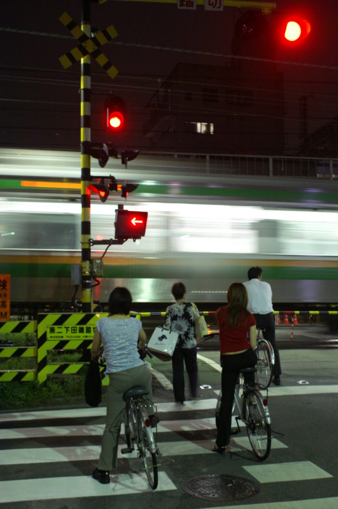 Rail crossing, people waiting