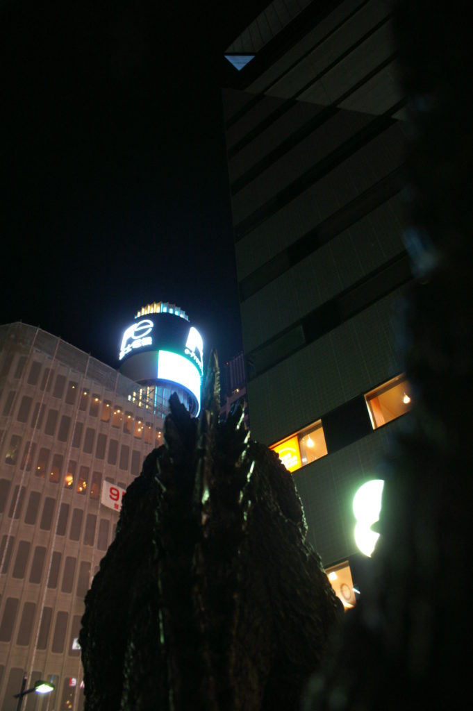 Godzilla facing buildings