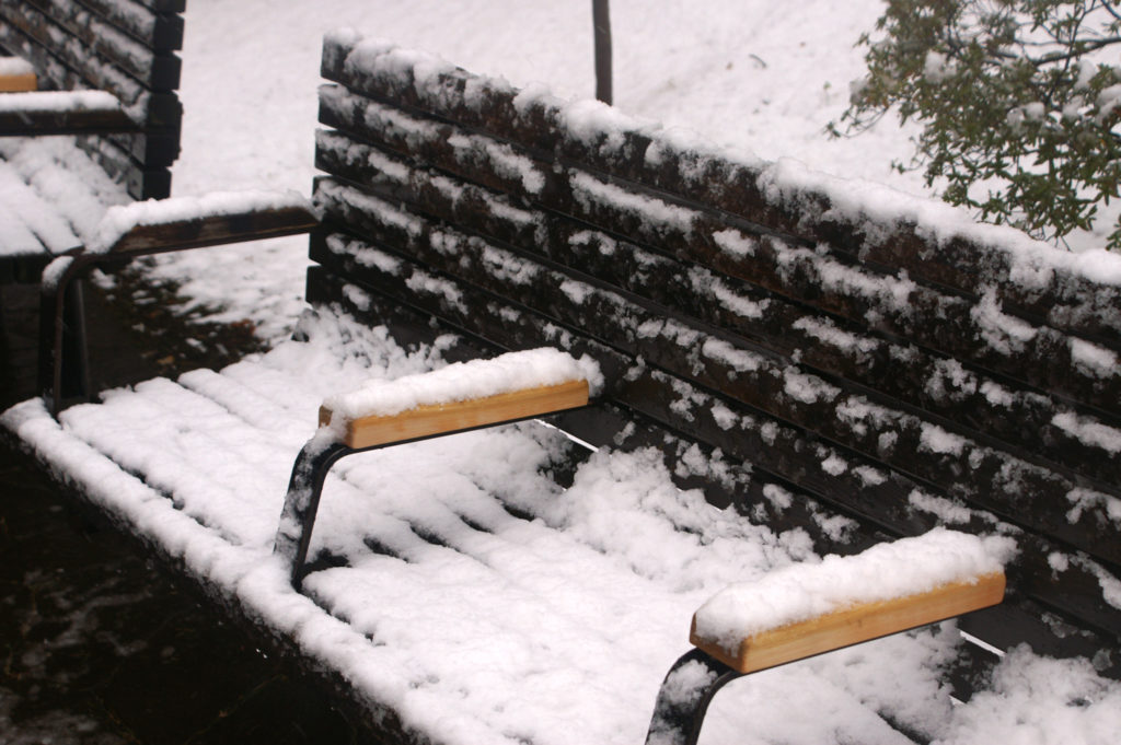 Snow covered bench