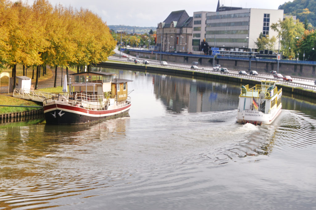 Two boats on the water, fall colours