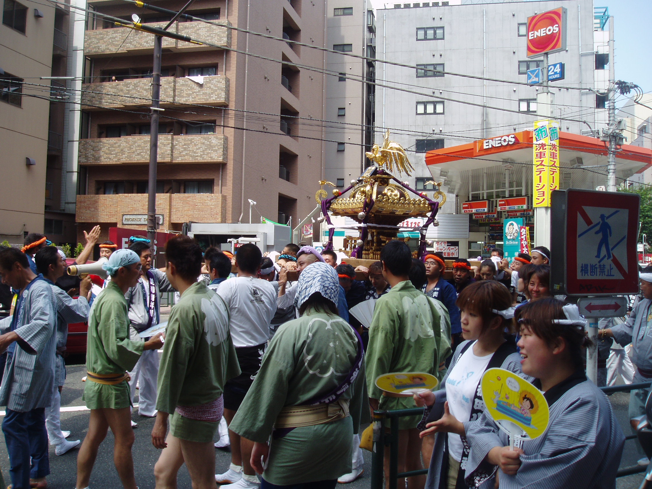 Crowd with small portable shrine
