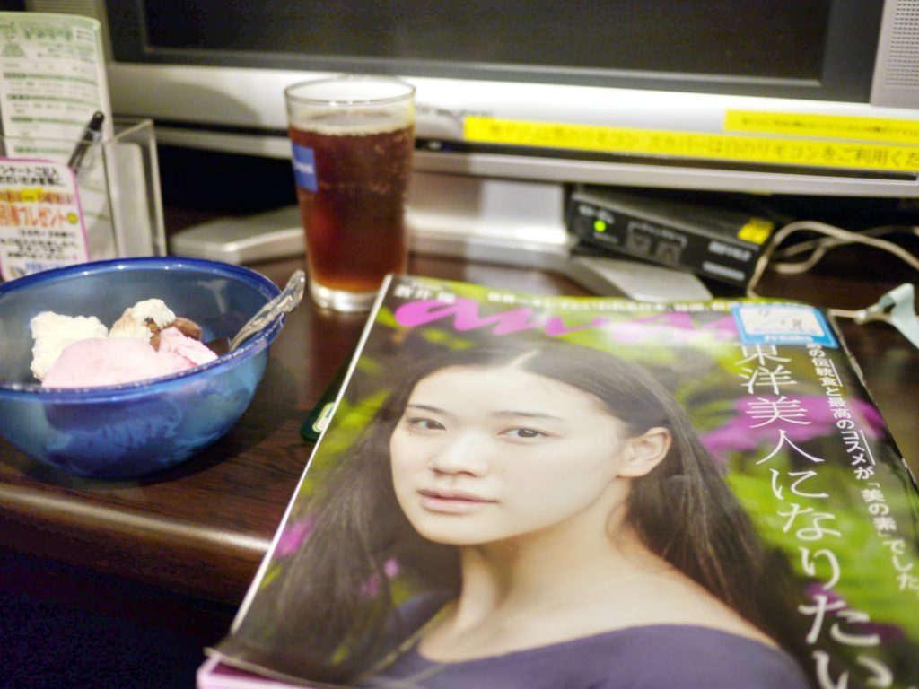 Magazine, ice cream, free soft drink on a desk