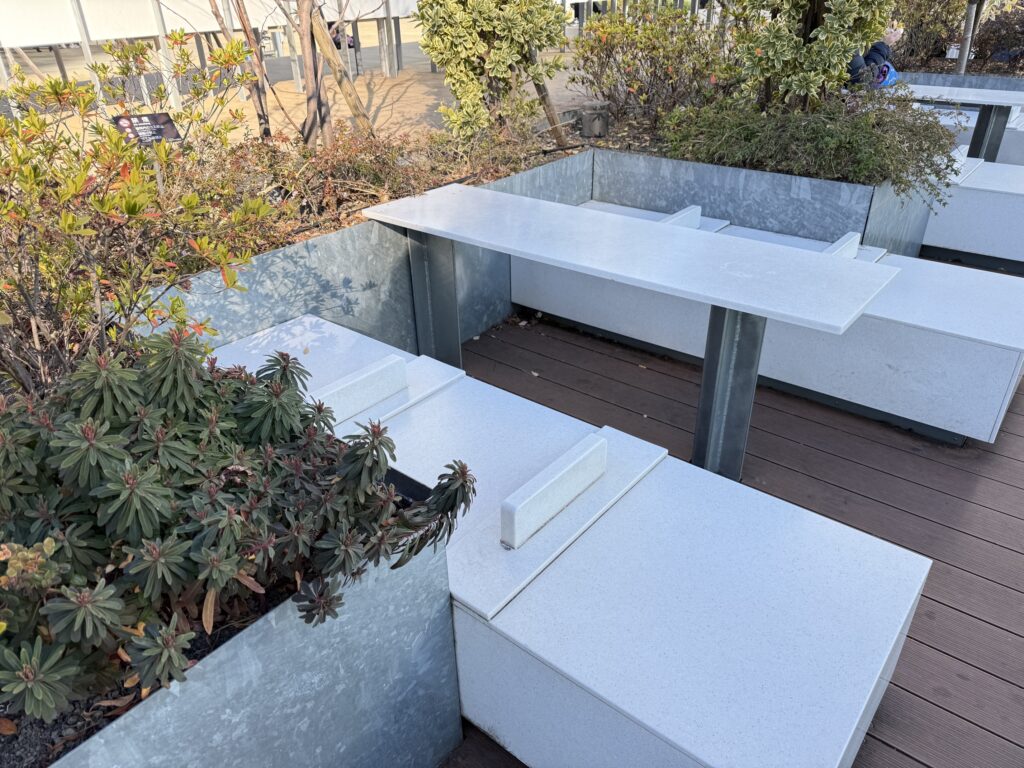 Seats and tables at the Suica Penguin Square